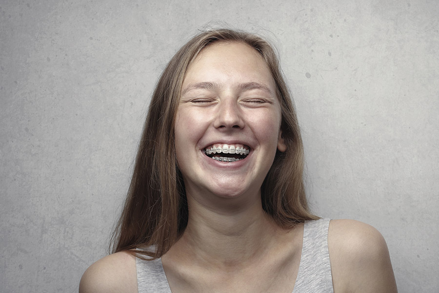 woman-in-gray-tank-top-laughing